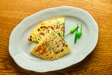 Flatbread stuffed with cheese and herbs. National Georgian dish