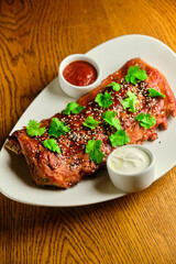 Grilled and smoked ribs with barbeque