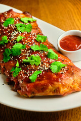 Grilled and smoked ribs with barbeque