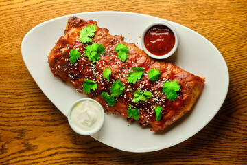 Grilled and smoked ribs with barbeque