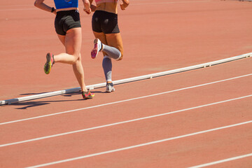 Fototapeta premium Athletes running on a treadmill