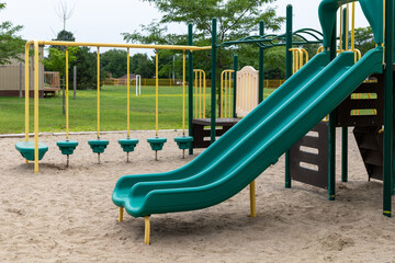 Playground structure with slide for children at schoolyard
