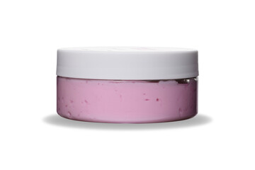 pink cream souffle or scrub in transparent plastic jar with white lid on white isolated background with shadow