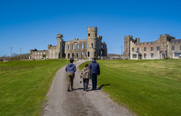 Tourists walking up to the Ruins of Ballyheigue castle in north county Kerry, the castle was burnt...