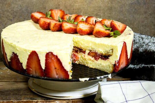 Sponge cake with strawberries and vanilla cream, french sweet food named Fraisier in french language