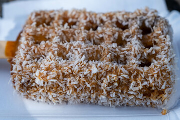 Belgian waffles with caramel sauce isolated on white background