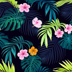 Seamless hand drawn tropical vector pattern with bright hibiscus flowers and exotic palm leaves on dark background. © Ms.Moloko