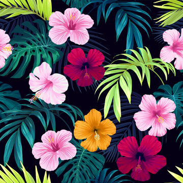 Seamless hand drawn tropical vector pattern with bright hibiscus flowers and exotic palm leaves on dark background.