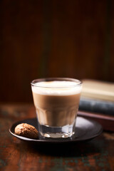 Coffee with milk on dark wooden background. Soft focus. Copy space.	                                                                                                                                  