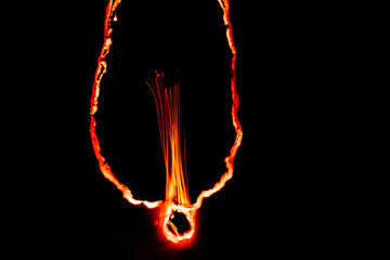 burning paper, glowing edge of paper on a black background