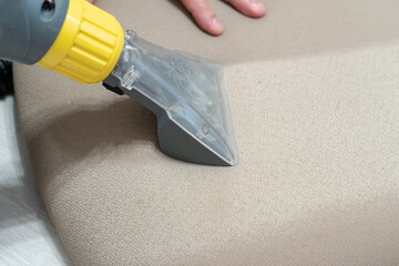 Manual cleaning of furniture with a steam cleaner. House cleaning concept. Before and after deep...