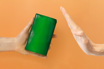 Man’s hand reject green paper package of product. Empty. Mock up. Green. Commercial. Cardboard....