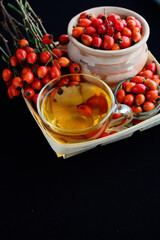 Dog rose, bunch branch Rosehips Rosa canina hips, goji berries and sea buckthorn and herbal tea - Medicinal plants herbs composition to enhance immunity and vitamins