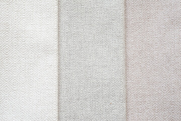 Fototapeta premium Background from vertical elements. set of beige fabrics in different shades. Homogeneous texture of materials.