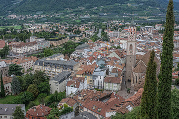 Aerial view of Old  Steinach Quarter and New Merano with St. Nicholas Cathedral on the  Cathedral Square and Passirio River in the background, Merano, South Tyrol, Italy.