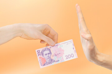 Man's refusing 200 hryvnias on a yellow background. Ukrainian. During. Uah. Wealth. Prohibition....