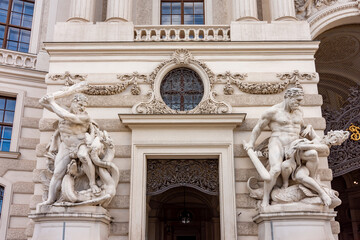 Sculptures at Hofburg palace on St. Michael square (Michaelerplatz) in Vienna, Austria