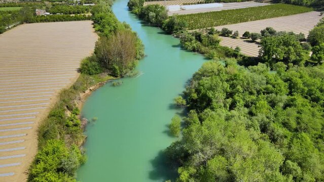4K beautiful lake in the field coming from big mountains