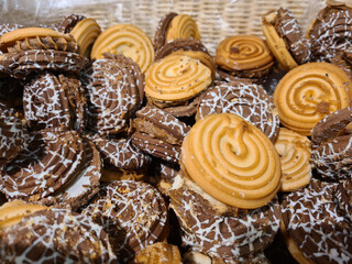Round cookies with chocolate and cream closeup