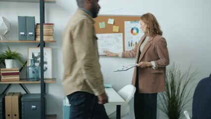 Business people working in modern office busy with corporate activities concentrated on job. Workplace and motivated employees concept.