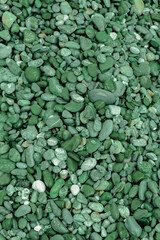 texture background of helki stones. green stones, trendy green background. colors of 2022. free space for text