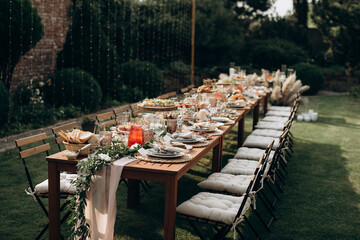 served banquet table with fresh dishes with food