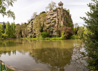 Paris, France - 04 10 2022: Park des Buttes Chaumont. View of the Temple of the Sibyl in the belvedere Island