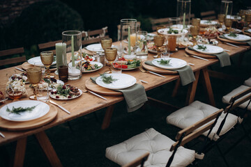 served banquet table with fresh dishes with food