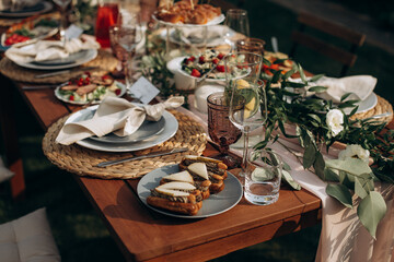 served banquet table with fresh dishes with food