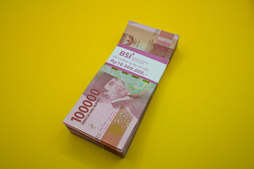 BSI Bank. Bank Syariah Indonesia. IDR 100,000 yellow isolated. Rp100,000 Bank Indonesia money.