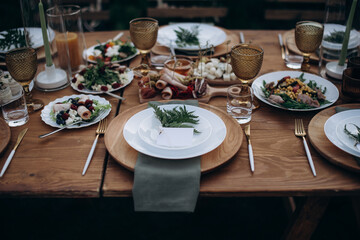 served banquet table with fresh dishes with food