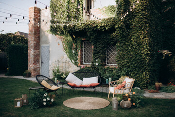 relaxation area with wicker furniture in the garden patio