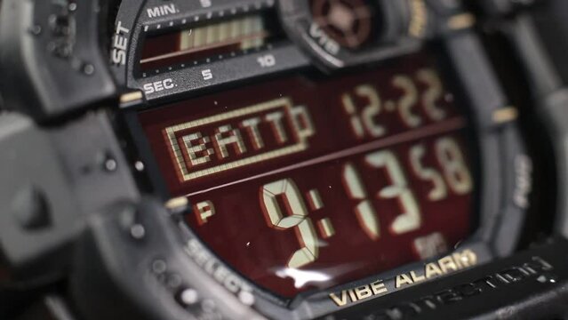Macro close up of a tactical digital watch face functioning
