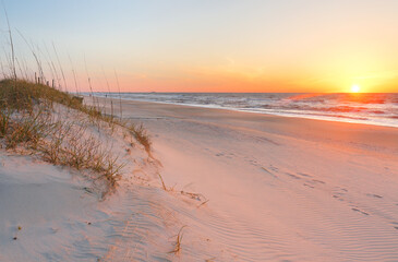 Beautiful sunrise over Kure Beach, Kure Beach, North Carolina USA. Kure Beach is a town 15 miles south of Wilmington, North Carolina