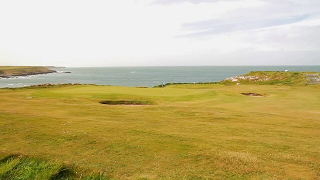 View over the northern end of Porthdinllaen peninsula with golf green, North Wales.