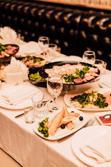 Beautifully serrated table with various dishes and snacks