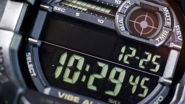 Macro close up of a tactical digital watch face functioning
