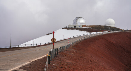 Dirt road at the summit of the Mauna Kea volcano on the Big Island of Hawaii leading to several...