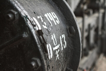 View of the mechanical unit of an old steam locomotive closeup with selective focus, piece of machinery