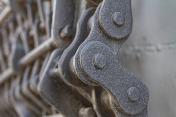 View of the metal chain of the mechanical unit of an old steam locomotive closeup, piece of machinery