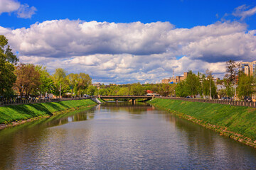 Fototapeta na wymiar Cityscape - view of the river Lopan and the embankment in the city of Kharkiv, Ukraine