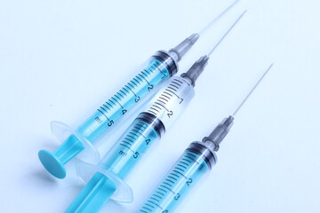 Medical syringe on a white background. A syringe for injection. The concept of health and beauty