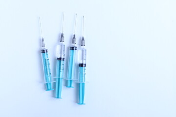 Medical syringe on a white background. A syringe for injection. The concept of health and beauty