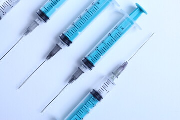 Medical syringe on a white background. A syringe for injection. The concept of health and beauty