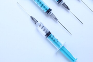 Medical syringe on a white background. A syringe for injection. The concept of health and beauty