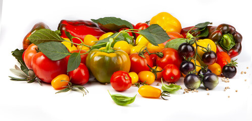Assorted tomatoes and vegetables isolated on white background. Photo for your design. - 501636397