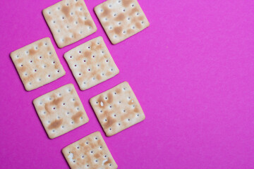 cracker cookies on a pink background