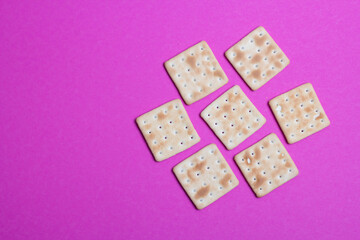 cracker cookies on a pink background