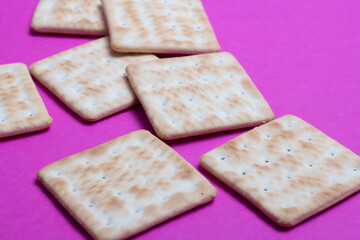 cracker cookies on a pink background