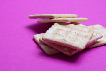 cracker cookies on a pink background